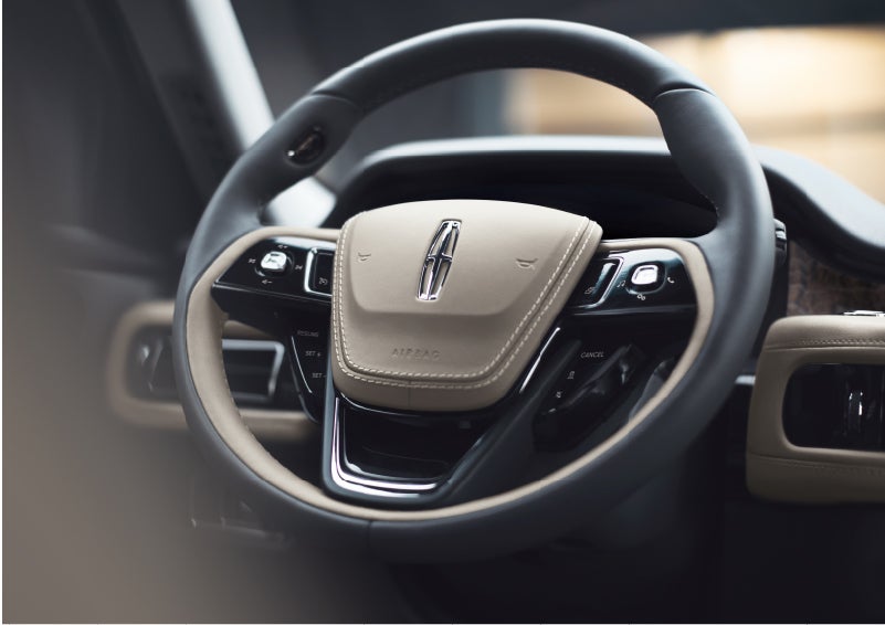 The intuitively placed controls of the steering wheel on a 2023 Lincoln Aviator® SUV | Dave Sinclair Lincoln in Ballwin MO