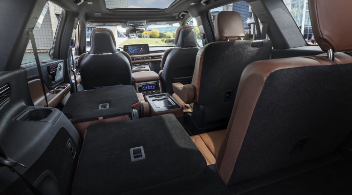 One side of the PowerFold® third-row seat and a second-row seat are folded forward in the 2026 Lincoln Aviator® SUV. | Dave Sinclair Lincoln in Ballwin MO