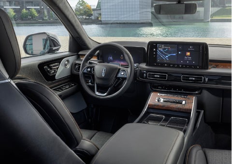 The interior of the 2026 Lincoln Aviator® SUV is shown parked with a view of a harbor through the windshield. | Dave Sinclair Lincoln in Ballwin MO