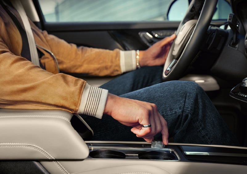 The driver of a 2026 Lincoln Corsair® SUV is shown selecting a drive mode. | Dave Sinclair Lincoln in Ballwin MO