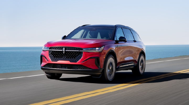 A 2026 Lincoln Nautilus® SUV is being driven on a seaside roadway. | Dave Sinclair Lincoln in Ballwin MO