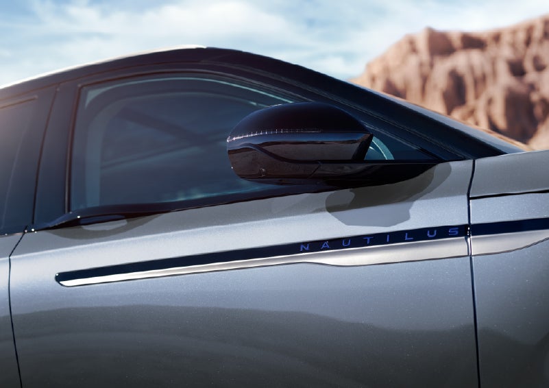 Blue lettering on the side of the vehicle that reads Nautilus indicates the available Hybrid Powertrain. | Dave Sinclair Lincoln in Ballwin MO