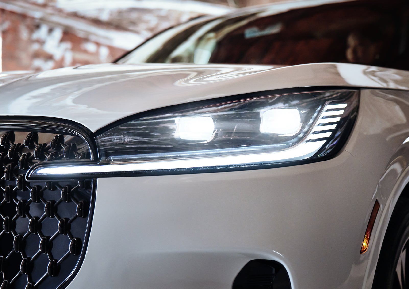 A close-up of a headlamp on the 2027 Lincoln Aviator® SUV is shown. | Dave Sinclair Lincoln in Ballwin MO