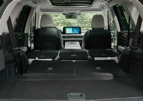 A rear to front view of the interior of a 2027 Lincoln Aviator® Black Label™ SUV shows the third and second rows folded flat | Dave Sinclair Lincoln in Ballwin MO